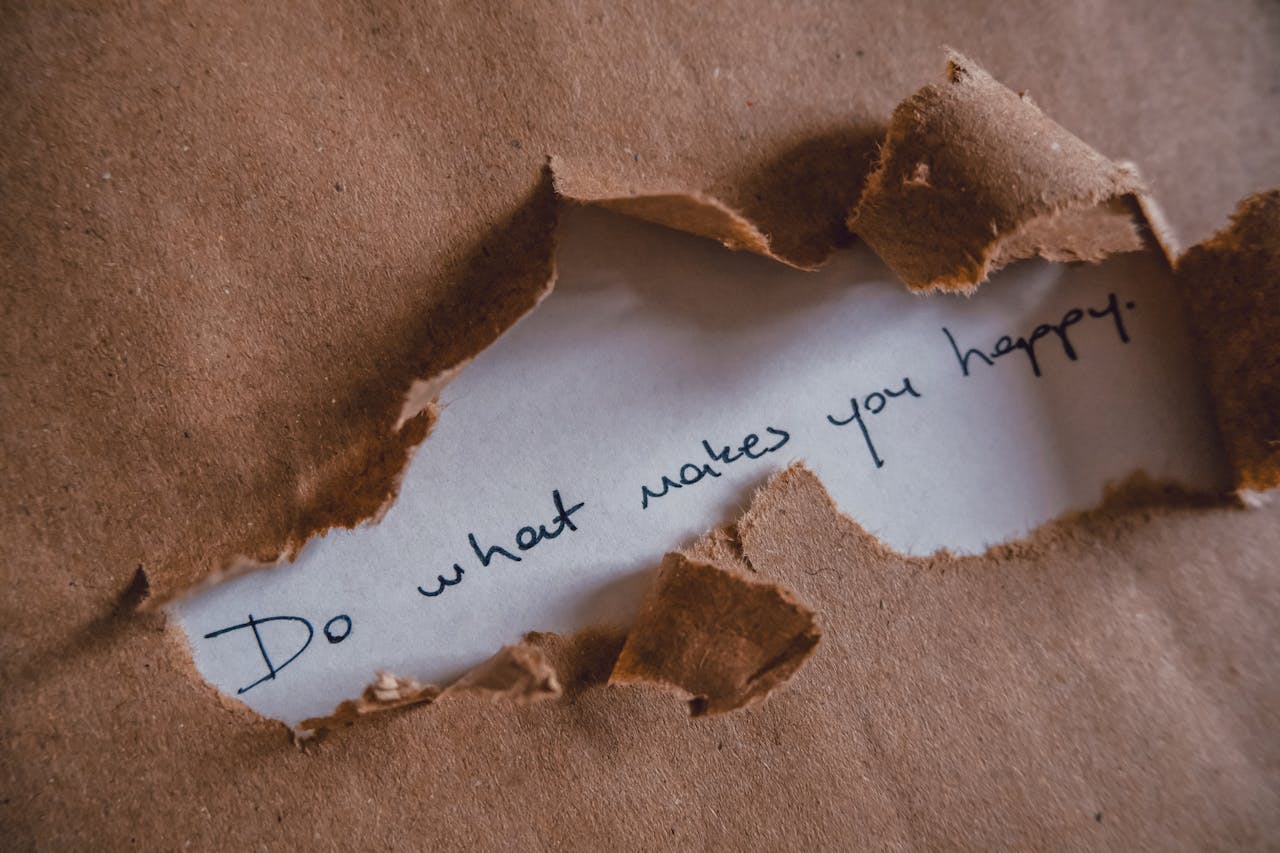 digital Brown paper revealing message 'Do what makes you happy.'